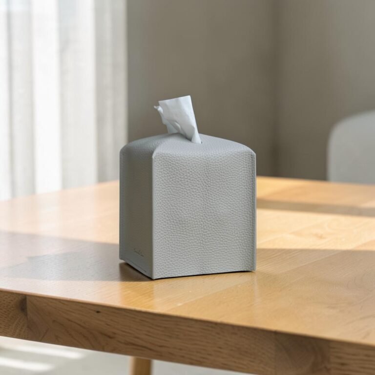 Gray PU leather tissue box cover on a light wood table